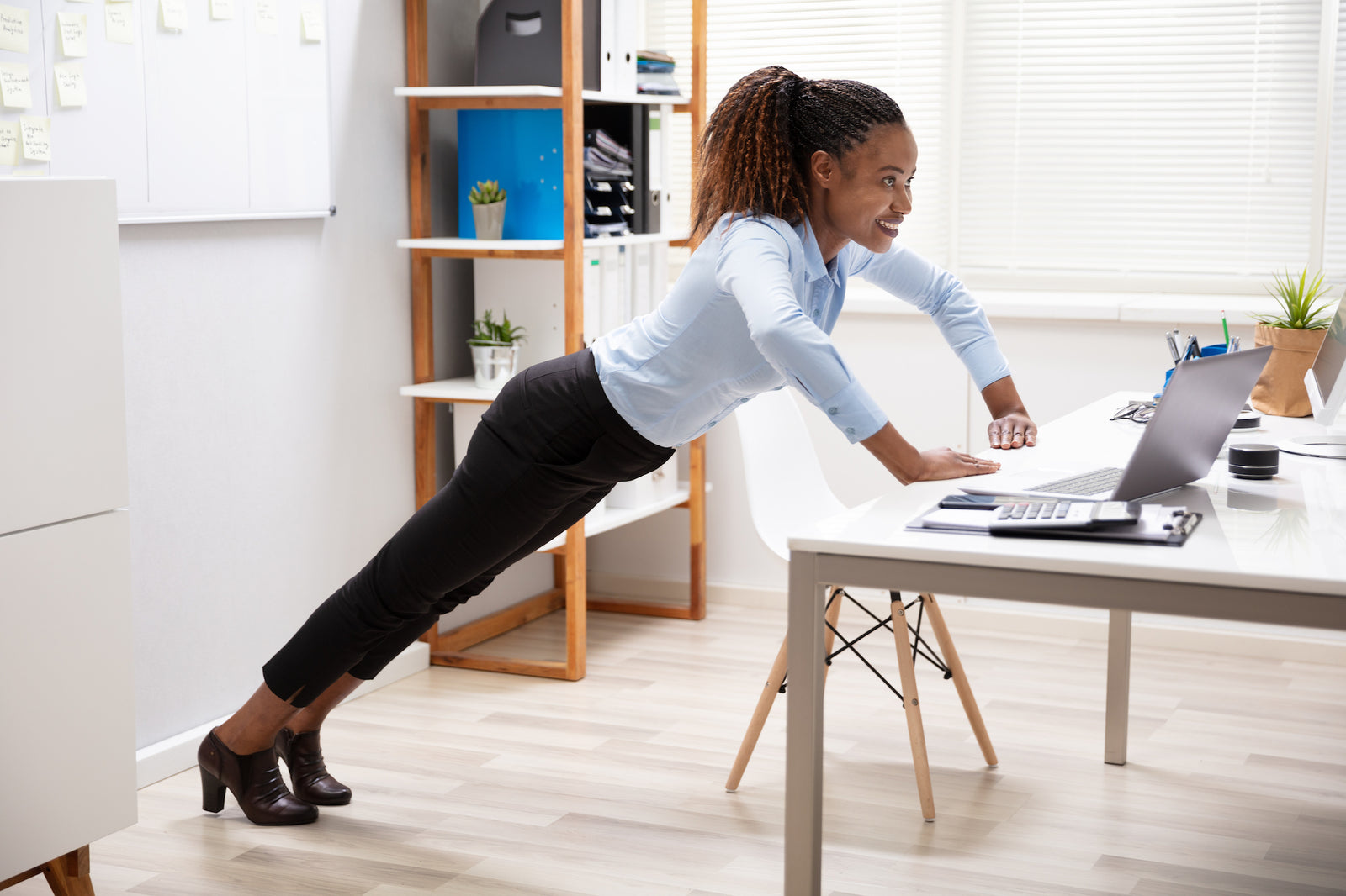 DeepMarine Collagen - Woman Exercising at Work to Combat Sitting Disease