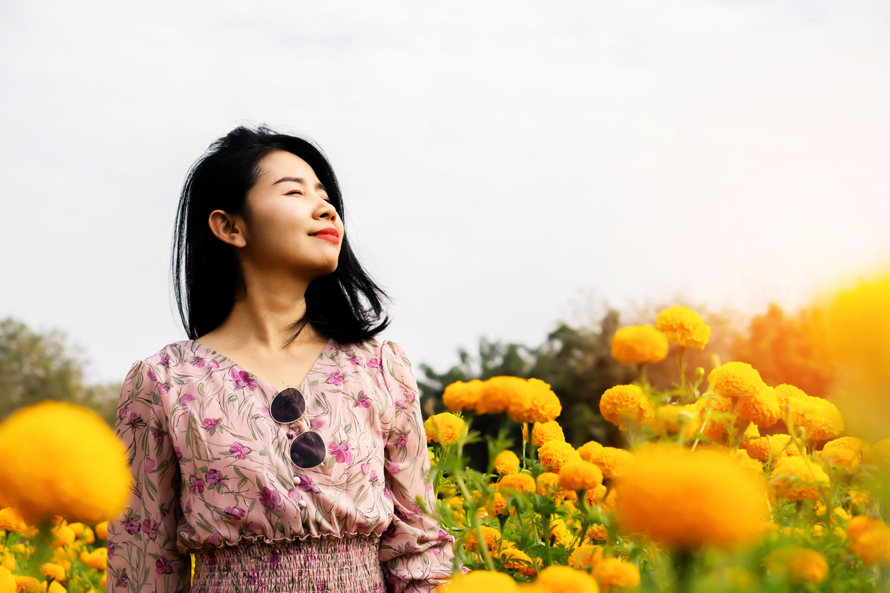 woman in a field of flower