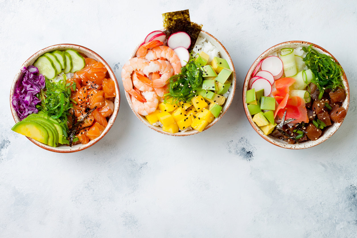 Healthy Hawiian bowls with salmon and avocado and veggies