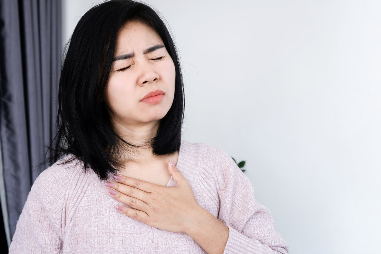 woman with heartburn